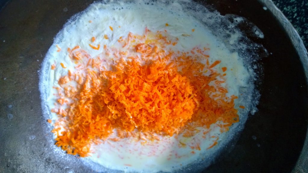 Grated carrot in milk.